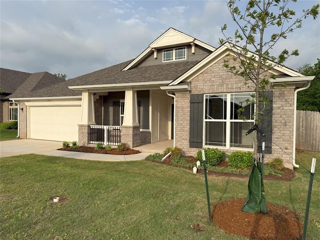 craftsman-style house with concrete driveway, a front lawn, an attached garage, and covered porch