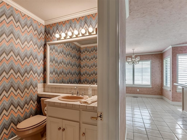 13504 Fox Creek Dr, Oklahoma City, OK 73131 - bathroom featuring baseboards, ornamental molding, toilet, vanity, and tile patterned flooring