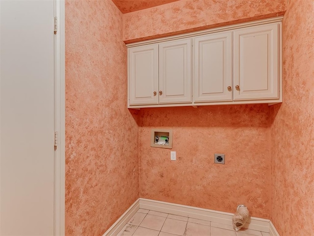 13504 Fox Creek Dr, Oklahoma City, OK 73131 - washroom featuring electric dryer hookup, washer hookup, cabinet space, baseboards, and tile patterned flooring