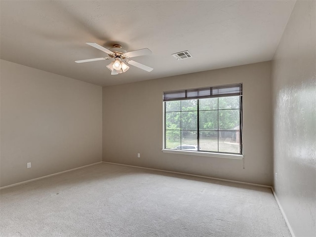 13504 Fox Creek Dr, Oklahoma City, OK 73131 - unfurnished room with a ceiling fan, light colored carpet, and baseboards