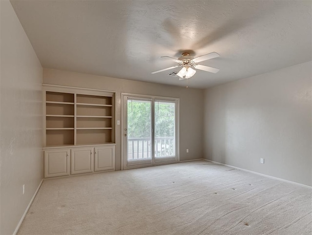 13504 Fox Creek Dr, Oklahoma City, OK 73131 - empty room with ceiling fan, light colored carpet, and baseboards