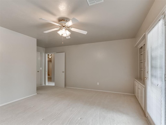 13504 Fox Creek Dr, Oklahoma City, OK 73131 - unfurnished bedroom with light carpet, ceiling fan, and baseboards