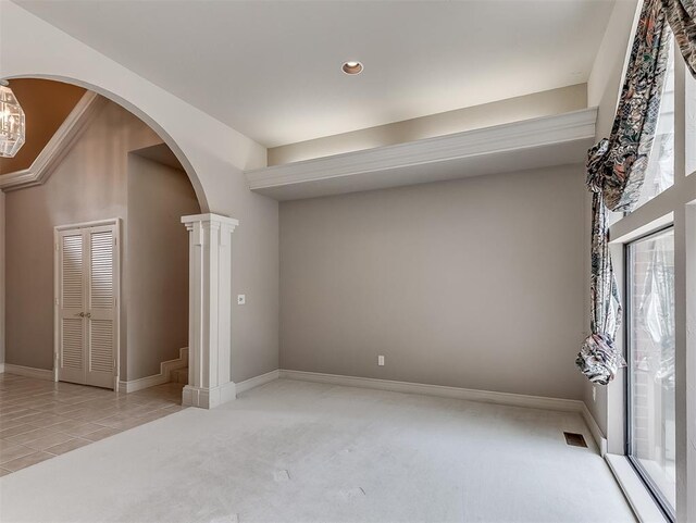 13504 Fox Creek Dr, Oklahoma City, OK 73131 - interior space with light colored carpet, arched walkways, recessed lighting, baseboards, and light tile patterned floors