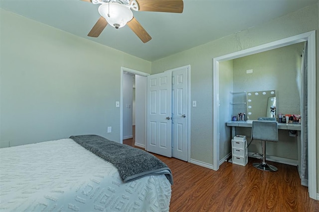 bedroom with baseboards, a ceiling fan, and wood finished floors