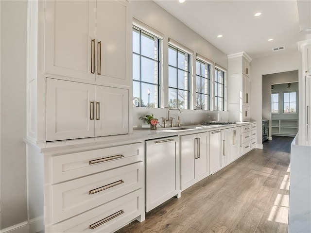 6105 NW 147th Ter, Oklahoma City, OK 73142 - bar featuring visible vents, recessed lighting, wood finished floors, and a healthy amount of sunlight