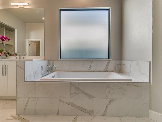6105 NW 147th Ter, Oklahoma City, OK 73142 - full bath with a sink, marble finish floor, and a bath