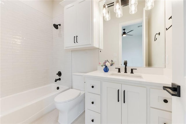 6105 NW 147th Ter, Oklahoma City, OK 73142 - full bathroom with ceiling fan, tile patterned floors, vanity, toilet, and washtub / shower combination