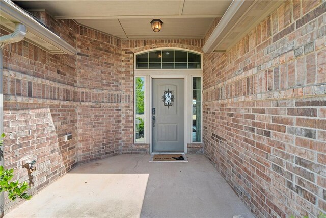 2828 Ryder Dr, Yukon, OK 73099 - view of exterior entry featuring brick siding