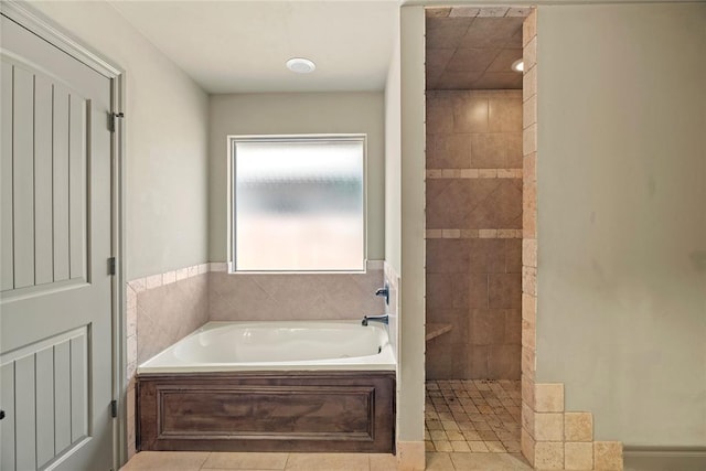 2828 Ryder Dr, Yukon, OK 73099 - bathroom featuring tile patterned floors, walk in shower, and a bath