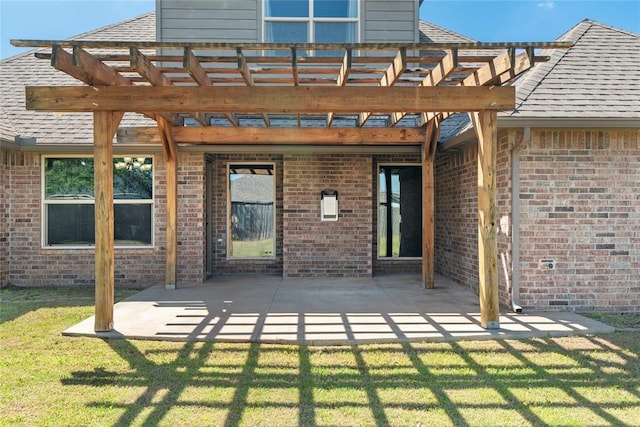2828 Ryder Dr, Yukon, OK 73099 - back of house with brick siding, a pergola, a yard, and a patio