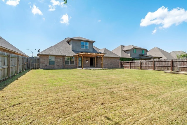2828 Ryder Dr, Yukon, OK 73099 - rear view of house with a lawn, a fenced backyard, a pergola, and brick siding