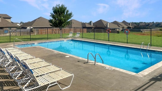 2828 Ryder Dr, Yukon, OK 73099 - community pool with a yard, fence, and a residential view