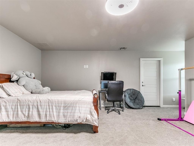 bedroom featuring baseboards, visible vents, and carpet