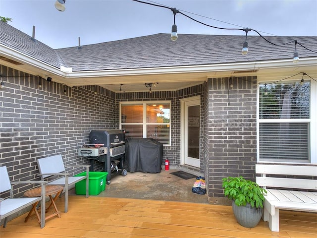 wooden deck with grilling area