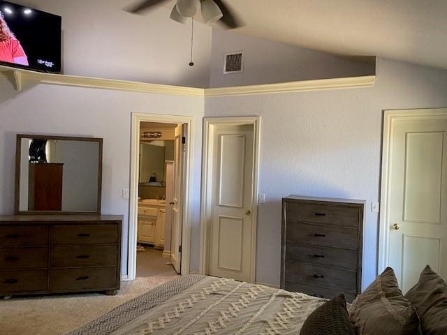 bedroom featuring ensuite bathroom, visible vents, lofted ceiling, ceiling fan, and carpet floors