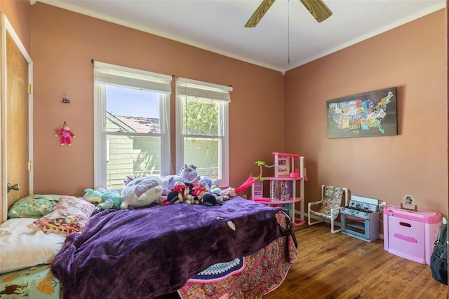 724 Maple St, Perry, OK 73077 - bedroom featuring ceiling fan, ornamental molding, and wood finished floors