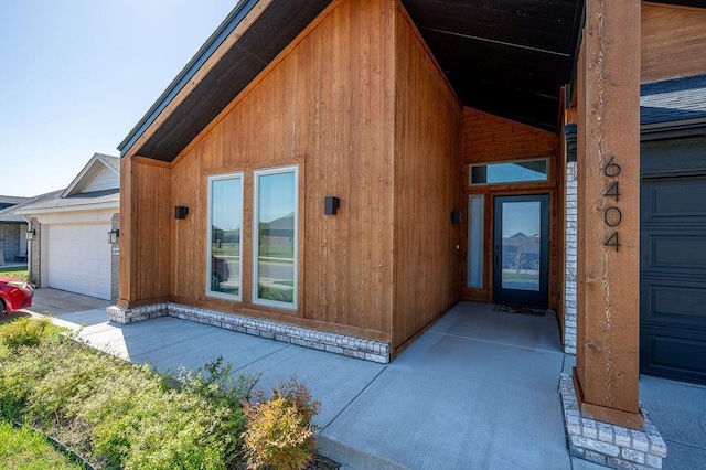 view of exterior entry with an attached garage