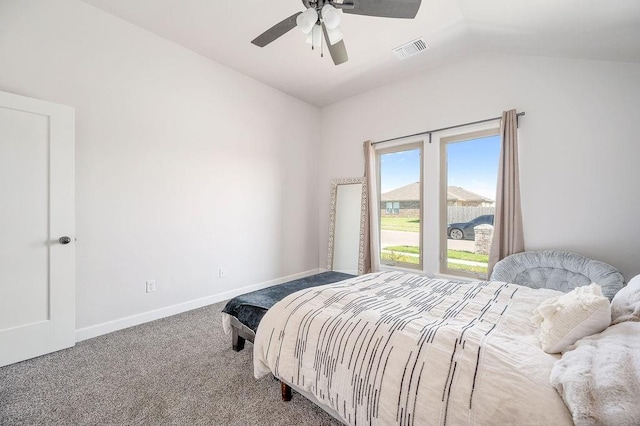 carpeted bedroom with lofted ceiling, a ceiling fan, visible vents, and baseboards