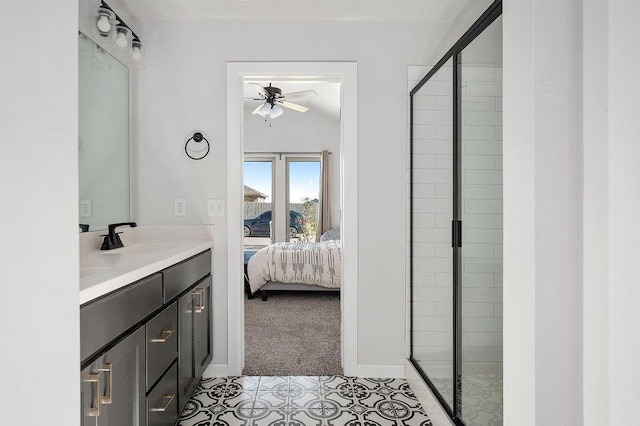 bathroom with ensuite bathroom, vanity, a ceiling fan, and a stall shower