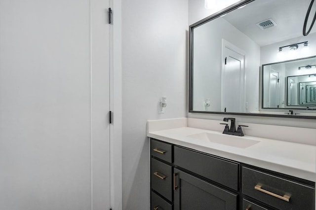 bathroom with visible vents and vanity