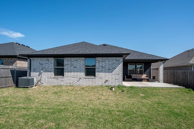 rear view of house with a fenced backyard, an outdoor hangout area, brick siding, and a patio