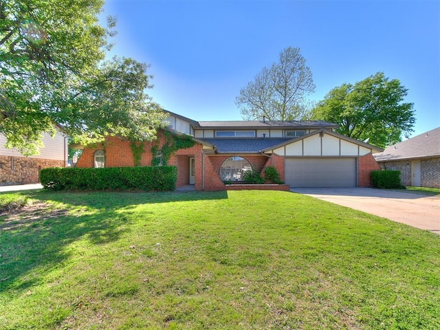 11609 Windmill Rd, Oklahoma City, OK 73162 - view of front facade with concrete driveway, a front lawn, brick siding, and a garage