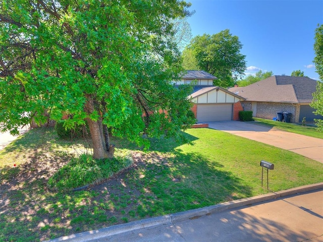 11609 Windmill Rd, Oklahoma City, OK 73162 - obstructed view of property featuring brick siding, a front yard, and concrete driveway