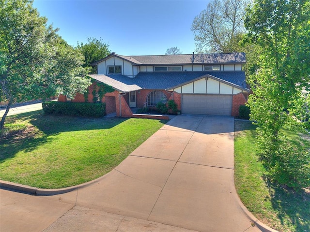 11609 Windmill Rd, Oklahoma City, OK 73162 - view of front of home with a garage, driveway, a front yard, and brick siding