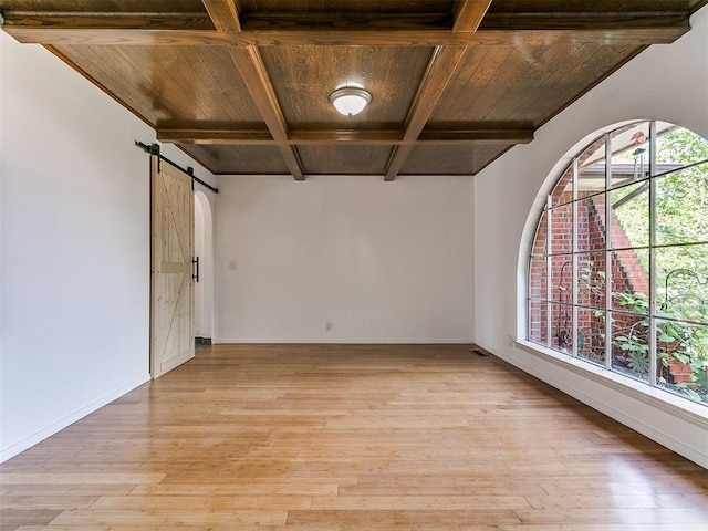 11609 Windmill Rd, Oklahoma City, OK 73162 - spare room with light wood finished floors, wooden ceiling, beamed ceiling, and a barn door
