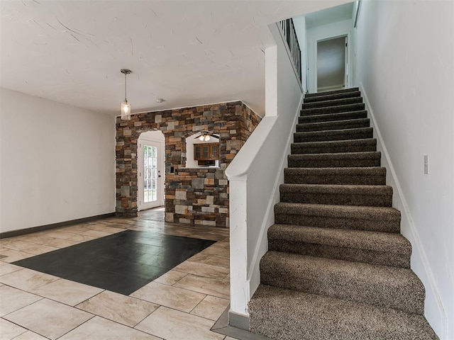 11609 Windmill Rd, Oklahoma City, OK 73162 - stairs featuring arched walkways and baseboards