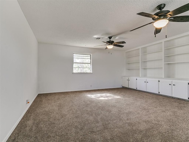 11609 Windmill Rd, Oklahoma City, OK 73162 - empty room with carpet flooring, a textured ceiling, visible vents, baseboards, and ceiling fan
