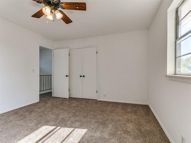 11609 Windmill Rd, Oklahoma City, OK 73162 - unfurnished bedroom with carpet floors, a closet, baseboards, and ceiling fan