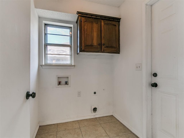 11609 Windmill Rd, Oklahoma City, OK 73162 - clothes washing area featuring light tile patterned flooring, baseboards, hookup for a washing machine, cabinet space, and electric dryer hookup