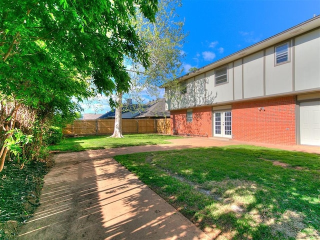 11609 Windmill Rd, Oklahoma City, OK 73162 - view of yard with french doors, a patio area, and a fenced backyard