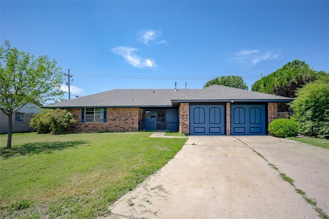1906 NW 66th Cir, Lawton, OK 73505 - ranch-style home featuring driveway, brick siding, a front lawn, an attached garage, and a shingled roof