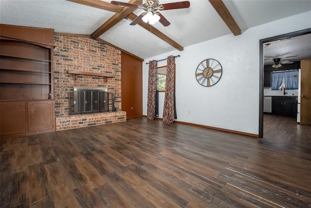 1906 NW 66th Cir, Lawton, OK 73505 - unfurnished living room with wood finished floors, ceiling fan, vaulted ceiling with beams, a textured ceiling, and a sink