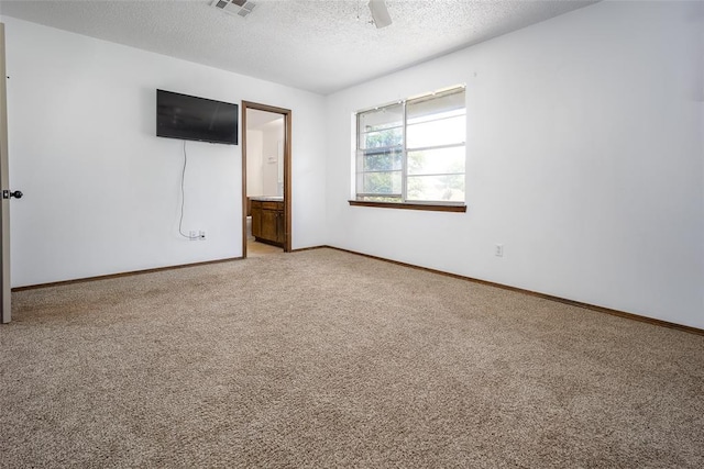 1906 NW 66th Cir, Lawton, OK 73505 - spare room featuring visible vents, light carpet, baseboards, ceiling fan, and a textured ceiling