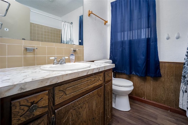 1906 NW 66th Cir, Lawton, OK 73505 - full bathroom with vanity, toilet, curtained shower, wood finished floors, and tasteful backsplash