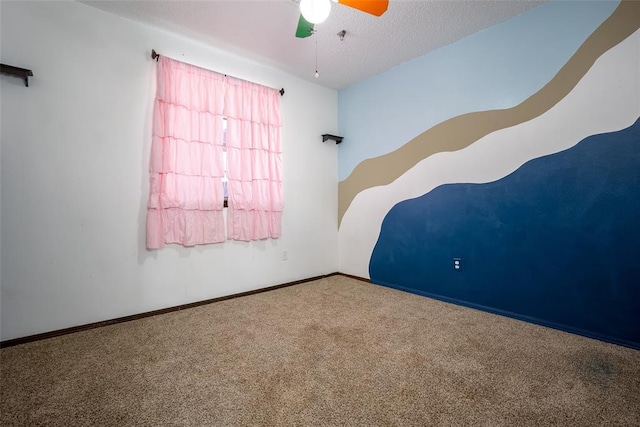 1906 NW 66th Cir, Lawton, OK 73505 - carpeted empty room featuring baseboards and a ceiling fan