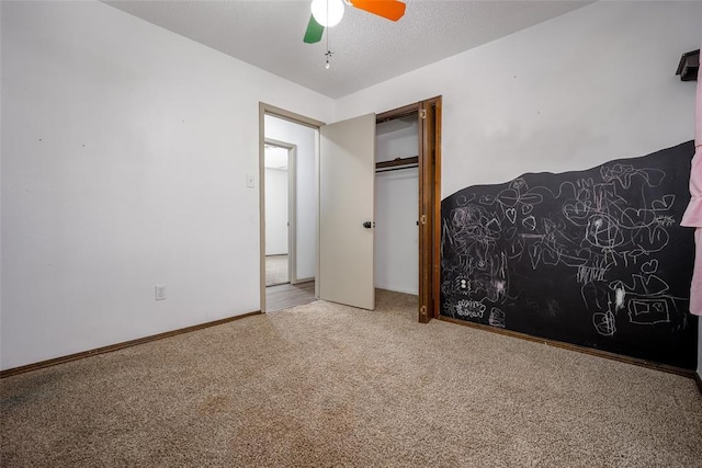 1906 NW 66th Cir, Lawton, OK 73505 - bedroom featuring carpet flooring, baseboards, ceiling fan, and a closet