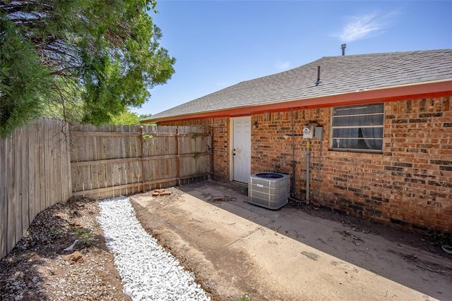 1906 NW 66th Cir, Lawton, OK 73505 - view of yard with fence, a patio, and central AC