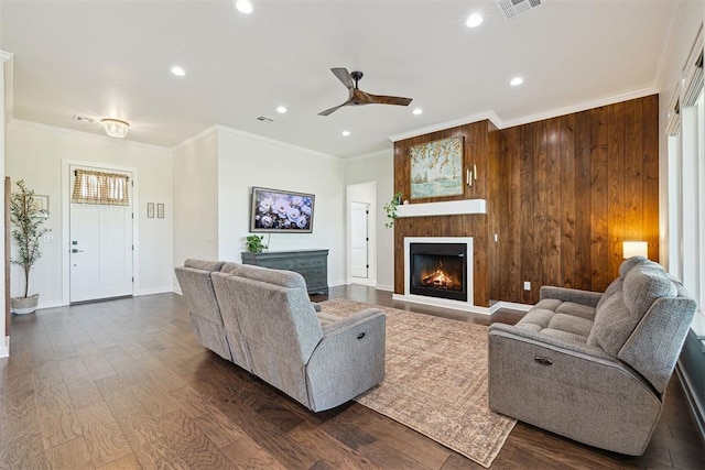 4162 Hawthorne St NW, Piedmont, OK 73078 - living area with a lit fireplace, a ceiling fan, crown molding, recessed lighting, and dark wood finished floors