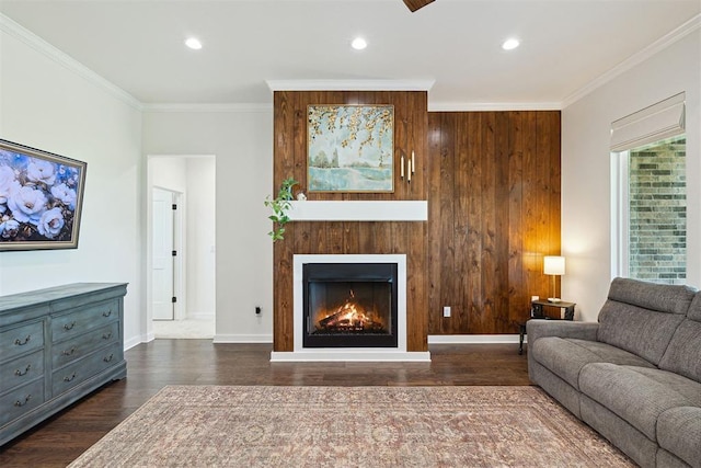 4162 Hawthorne St NW, Piedmont, OK 73078 - living area featuring wood finished floors, ornamental molding, a warm lit fireplace, recessed lighting, and wood walls