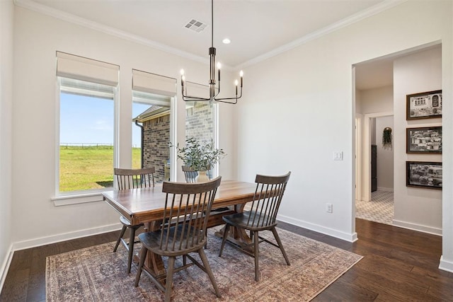 4162 Hawthorne St NW, Piedmont, OK 73078 - dining area featuring a chandelier, crown molding, dark wood-type flooring, and recessed lighting