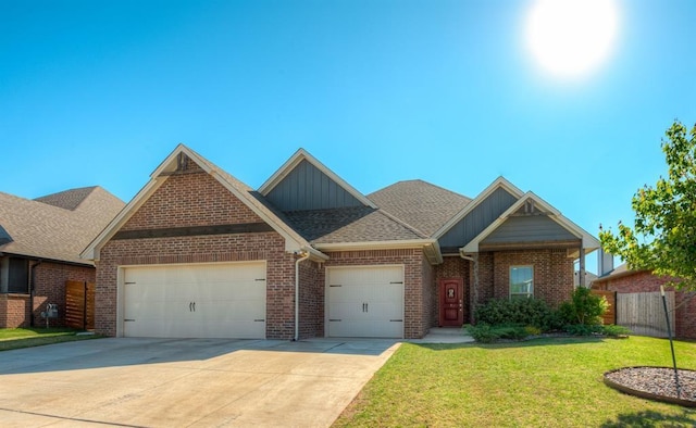 view of front facade with driveway, brick siding, an attached garage, board and batten siding, and a front yard