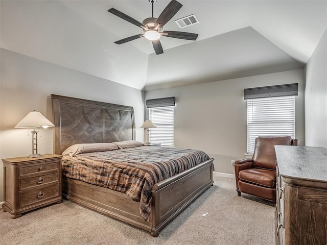 bedroom with light carpet, baseboards, visible vents, lofted ceiling, and ceiling fan