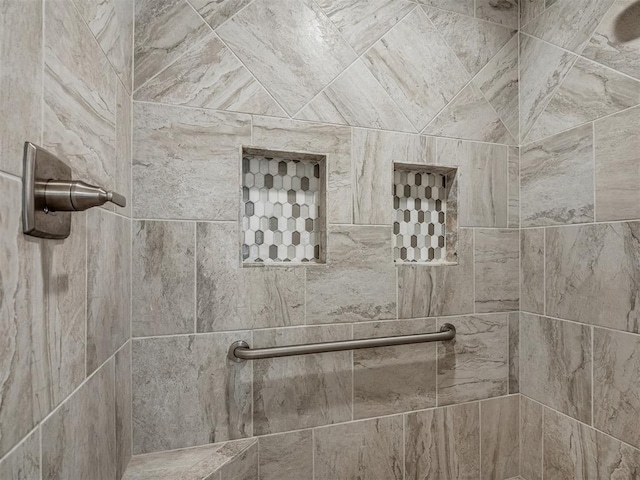 details with a tile shower