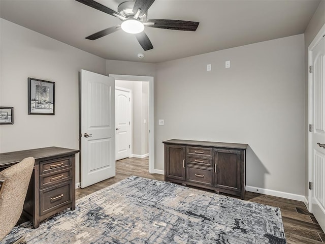 office with ceiling fan, baseboards, and wood finished floors
