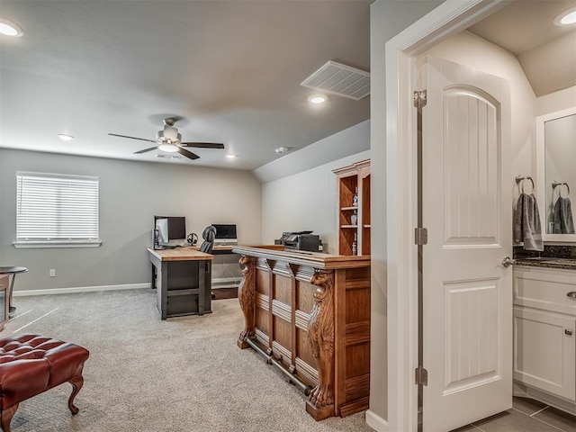 office space featuring light carpet, visible vents, recessed lighting, lofted ceiling, and a ceiling fan