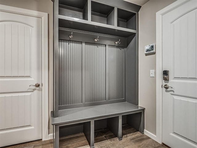mudroom featuring wood finished floors and baseboards